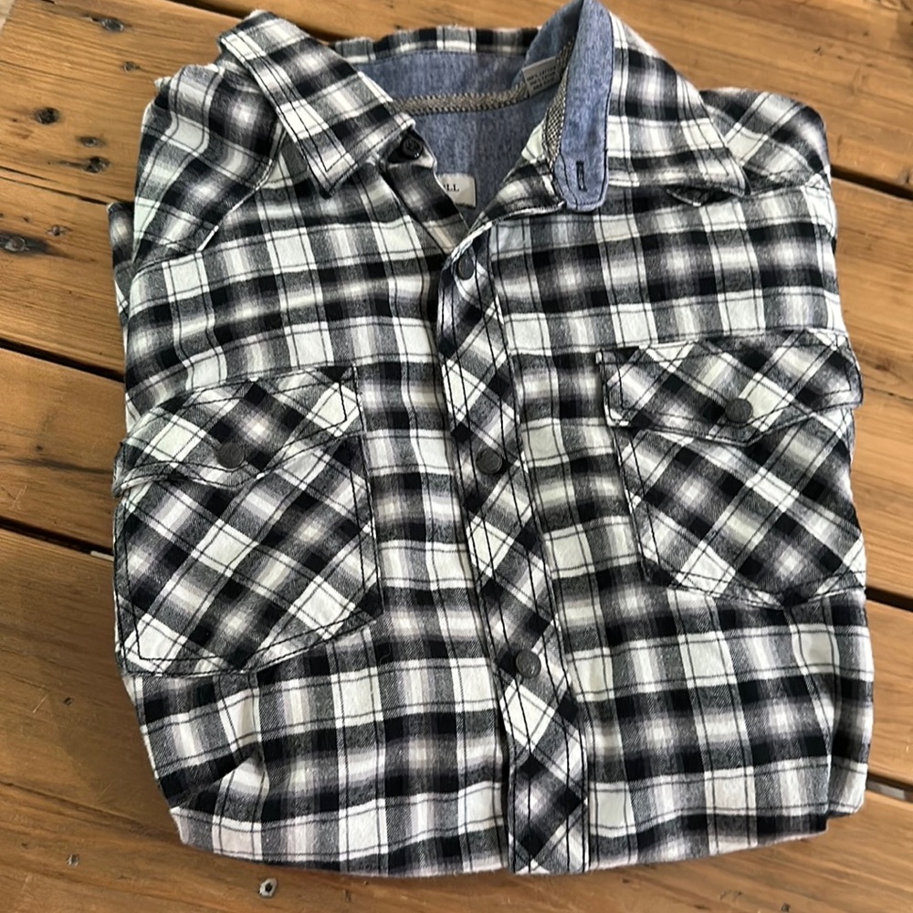 Black and white, long sleeved men’s button down.